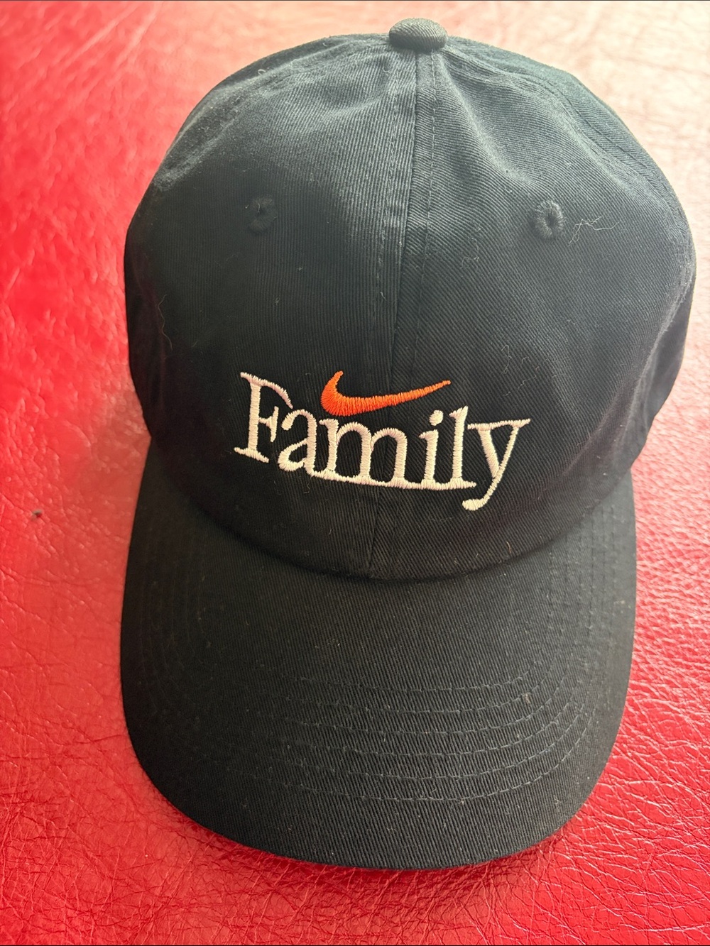 Black unstructured adjustable Nike cap embroidered with FAMILY. NWOT